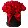 Rosas rojas en caja redonda negra